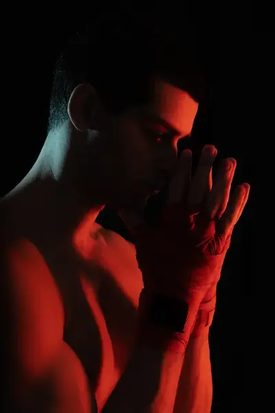 Man in red and teal light on Gentlove