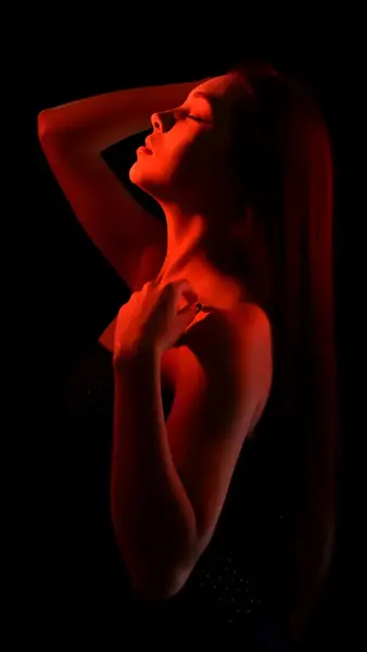 Woman in warm red light on Gentlove